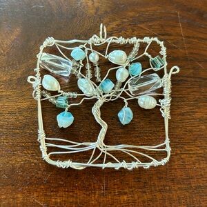 Handmade silver tone tree of life pendant. Aqua, pearl and crystal beads.